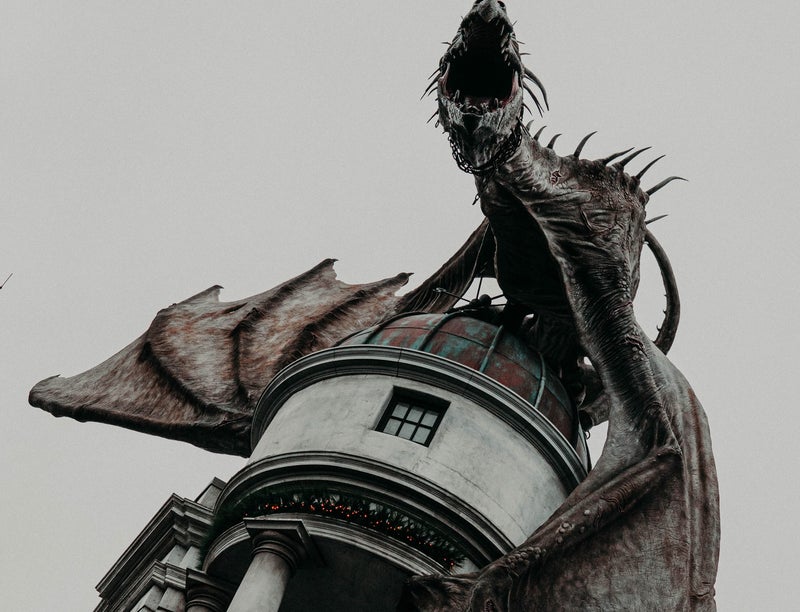 A dragon sculpture perched on a building